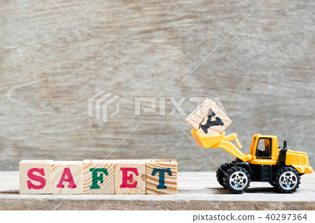 Toy bulldozer hold letter block y to word safety 40297364