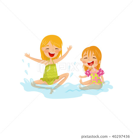 Cheerful kids making water splashes. Two little girls having fun at sea. Summer recreation. Colorful Cheerful kids making water splashes. Two little girls having fun at sea. Summer recreation. Colorful 40297436