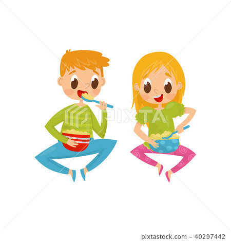Cheerful little kids sitting on floor and eating breakfast. Bowls full of cornflakes. Flat vector Cheerful little kids sitting on floor and eating breakfast. Bowls full of cornflakes. Flat vector 40297442