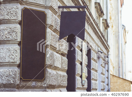 Old retro signboard on the wall of the old city. Old retro signboard on the wall of the old city. 40297690