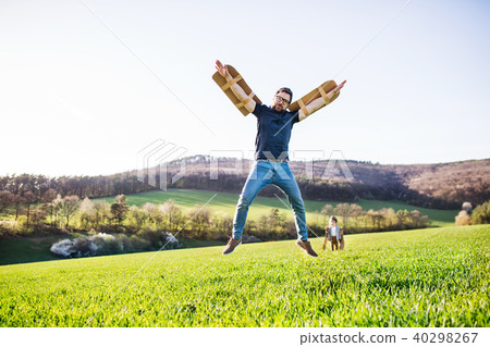 Happy toddler boy playing outside with father in spring nature. 40298267