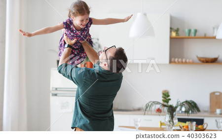 Father's day. Happy family daughter hugs his dad 40303623