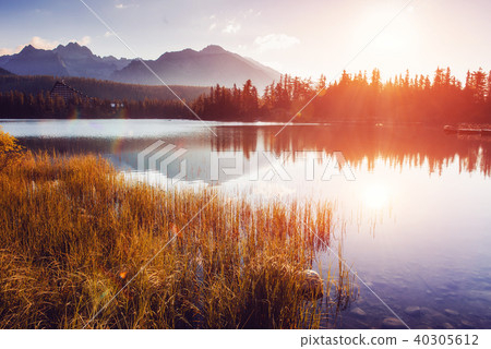 Majestic mountain lake in National Park High Tatra. Strbske pleso, Slovakia, Europe. Majestic mountain lake in National Park High Tatra. Strbske pleso, Slovakia, Europe. 40305612