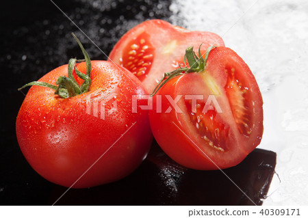 Tomatoes On A Glass Background Tomatoes On A Glass Background 40309171