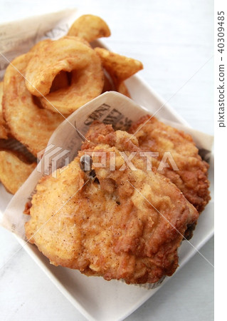 Fried chicken on the bone and french fries Fried chicken on the bone and french fries 40309485