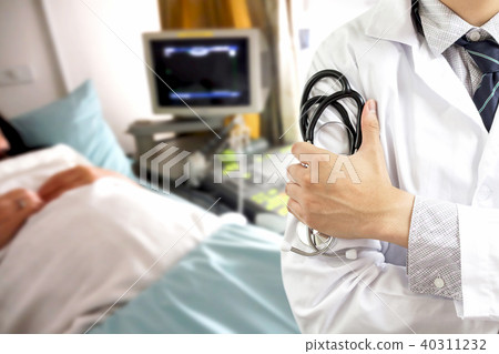 Doctor with stethoscope on hospital background Doctor with stethoscope on hospital background 40311232