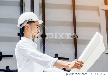 Engineering reading blueprint at the construction Engineering reading blueprint at the construction 40311737