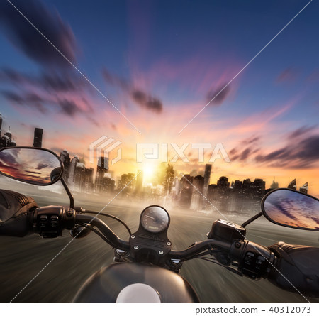 POV of motorcycle driver holding handlebar 40312073