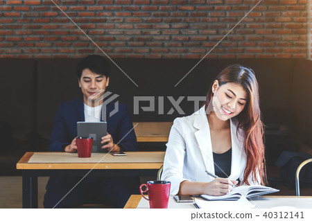 Businesswoman working at a coffee shop Businesswoman working at a coffee shop 40312141