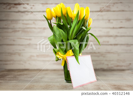 Yellow tulips on wooden background 40312146