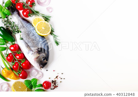 Uncooked fish on dark vintage background. Free 40312848