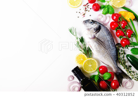 Uncooked fish on dark vintage background. Free 40312852