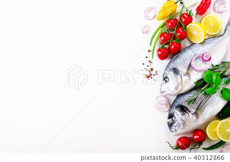Uncooked fish on dark vintage background. Free Uncooked fish on dark vintage background. Free 40312866