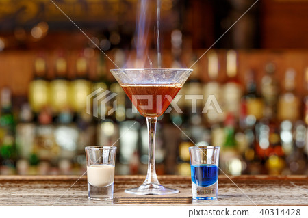 spectacular cocktail with fire 40314428