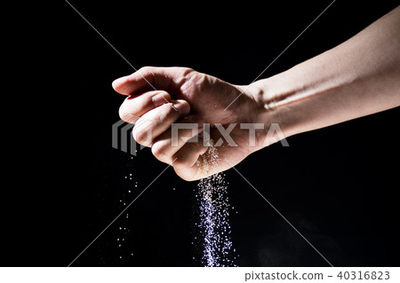 Hand grabbing the sand 40316823