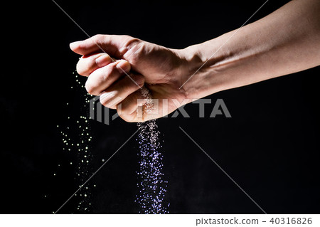 Hand grabbing the sand 40316826