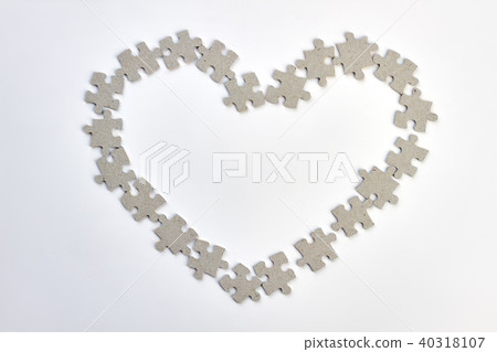 Heart frame made from puzzles. Heart frame made from puzzles. 40318107
