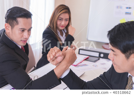 Arm wrestling in meeting for business competitive 40318662