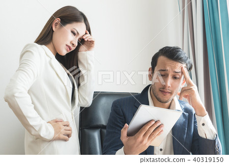 Boss and secretary stress out with finance report 40319150