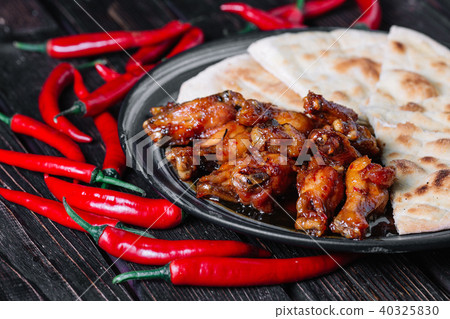 Juicy fried chicken wings with flatbread Juicy fried chicken wings with flatbread 40325830