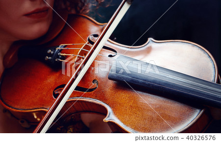 Violinist girl performs on stage. Violinist girl performs on stage. 40326576