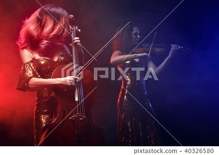 The cellist girl performs on stage. The cellist girl performs on stage. 40326580