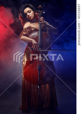 The cellist girl performs on stage. The cellist girl performs on stage. 40326697