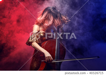 The cellist girl performs on stage. The cellist girl performs on stage. 40326715
