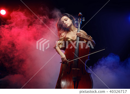 The cellist girl performs on stage. The cellist girl performs on stage. 40326717