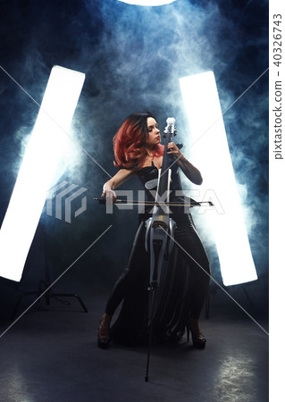 The cellist girl performs on stage. The cellist girl performs on stage. 40326743