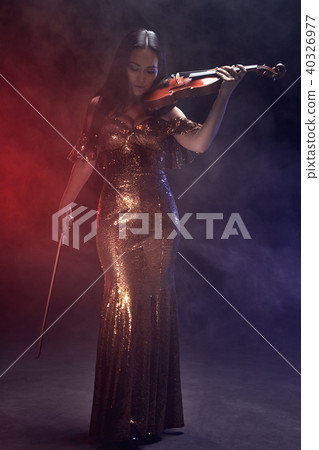 Violinist girl performs on stage. Violinist girl performs on stage. 40326977