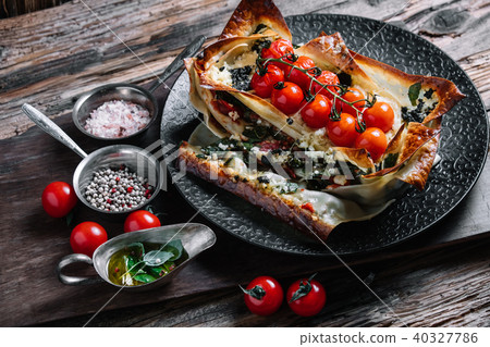 Vegetable lasagna with cherry tomatoes Vegetable lasagna with cherry tomatoes 40327786