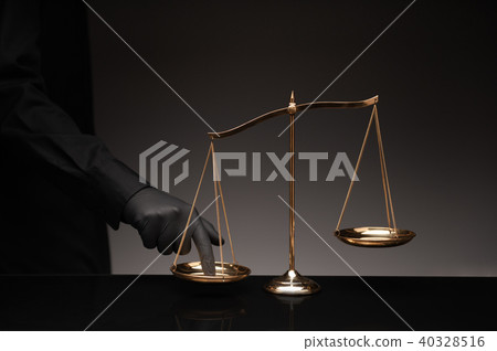 Man pressing on balance scale Man pressing on balance scale 40328516