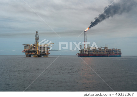 FPSO tanker vessel near Oil Rig platform. Offshore oil and gas industry 40332367