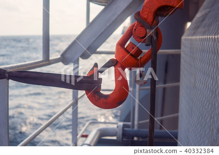 Offshore crane hook is secured for sea passage. 40332384