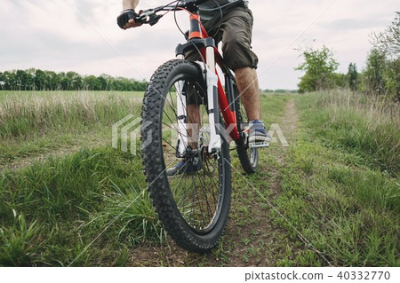 Man riding a bicycle at countryside road  40332770
