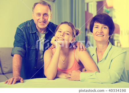 Portrait of happy family at the table Portrait of happy family at the table 40334198