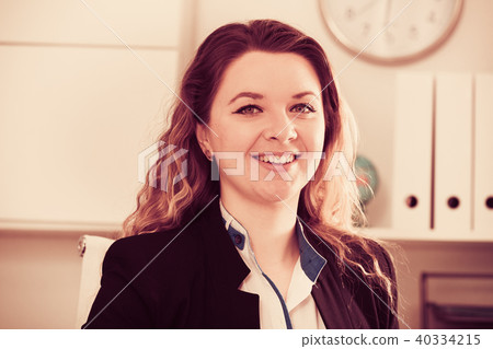 Portrait of young smiling girl in the office Portrait of young smiling girl in the office 40334215