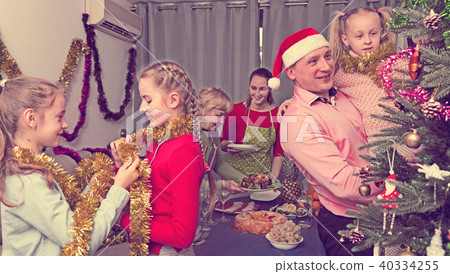 Happy family is preparing for celebration New Year together Happy family is preparing for celebration New Year together 40334255