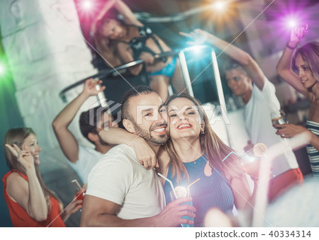 male and woman dancing and hugging on party 40334314