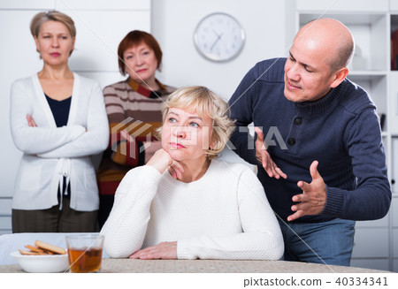 Mature man is apologizing to girlfriend for quarrel Mature man is apologizing to girlfriend for quarrel 40334341