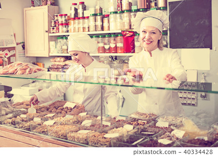 Two female sellers in confectionery Two female sellers in confectionery 40334428