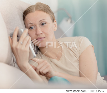 Upset woman with phone Upset woman with phone 40334537