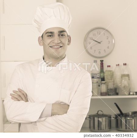 Portrait of chef which is staying on kitchen Portrait of chef which is staying on kitchen 40334932