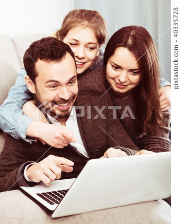 Family booking hotel online on laptop Family booking hotel online on laptop 40335728