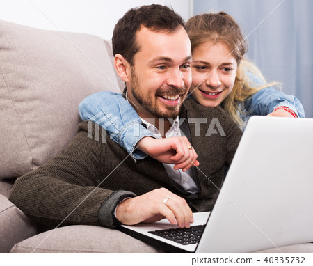 Father and daughter booking hotel online Father and daughter booking hotel online 40335732