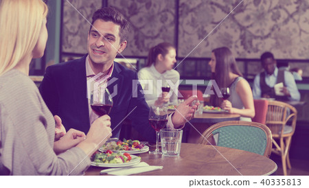 Cheerful man with girlfriend in restaurant Cheerful man with girlfriend in restaurant 40335813