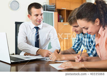 couple and banking agent discussing 40335868