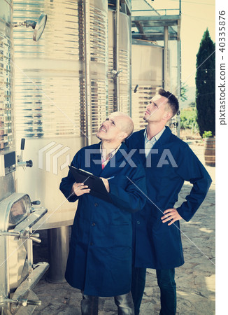 Worker taking notes in fermentation section 40335876