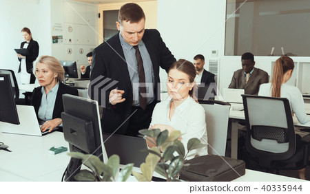 Outraged manager with frustrated girl in office 40335944